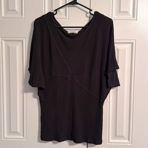 Kenar knit black top with cross pattern and tapered waist. Size L